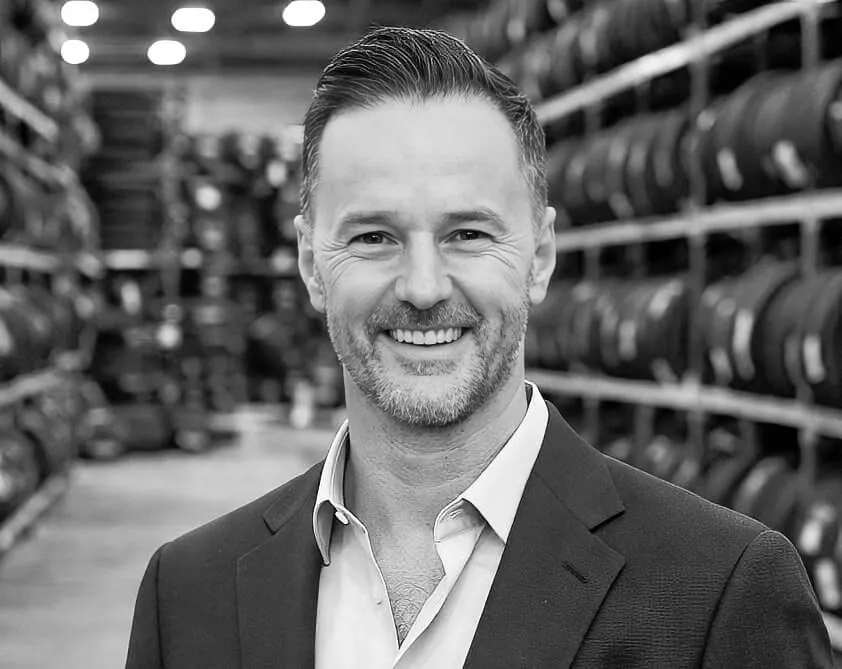 Michael Welch standing next to a Rolo tyre